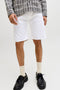 Front image of a model wearing the Rick original shorts in white, by brand Jack&jones
