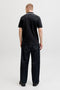 Back image of a model wearing the Blaze s/s polo in black, by brand Jack&jones