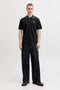 Front image of a model wearing the Blaze s/s polo in black, by brand Jack&jones