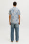 Back image of a model wearing the Honolulu aop ss shirt in blue, by brand Jack&jones