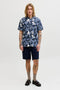 Front image of a model wearing the Honolulu aop ss shirt in navy, by brand Jack&jones