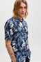 Front image of a model wearing the Honolulu aop ss shirt in navy, by brand Jack&jones