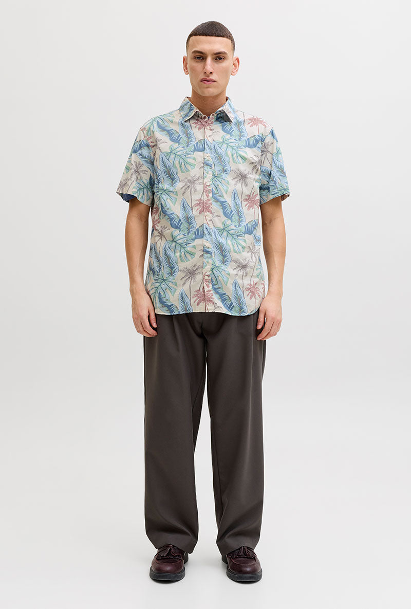 Front image of a model wearing Honolulu aop ss shirt in off white, by brand Jack&jones