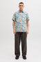 Front image of a model wearing the Honolulu aop ss shirt in off white, by brand Jack&jones