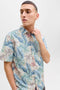 Front image of a model wearing the Honolulu aop ss shirt in off white, by brand Jack&jones