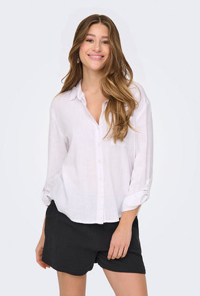 Front image of a model wearing Caya linen loose l/s shirt in white, by brand Jacqueline de yong