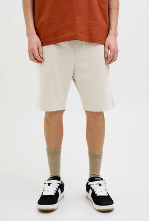 Front image of a model wearing the Gordon bradley sweat shorts in stone, by brand Jack&jones