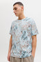 Front image of a model wearing the Honolulu aop ss tee in blue, by brand Jack&jones