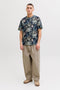 Front image of a model wearing the Honolulu aop ss tee in navy, by brand Jack&jones