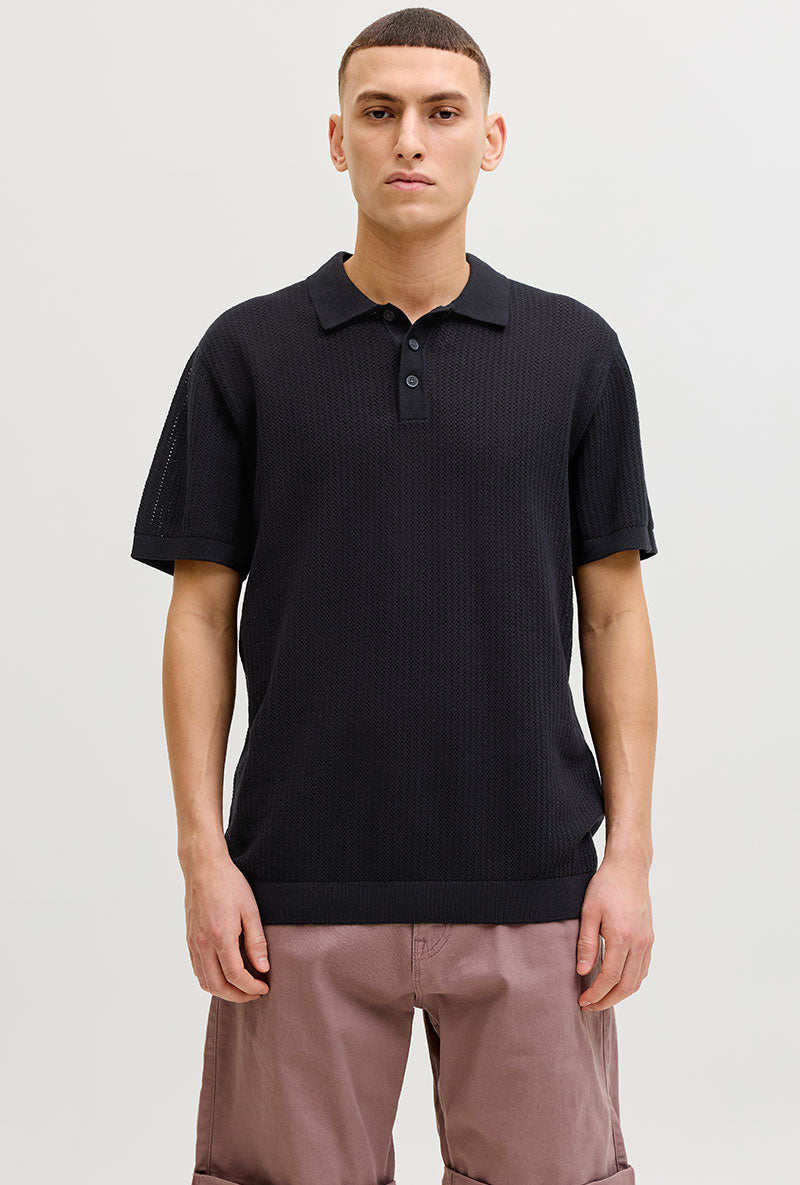 Front image of a model wearing Jess knit polo in black, by brand Jack&jones