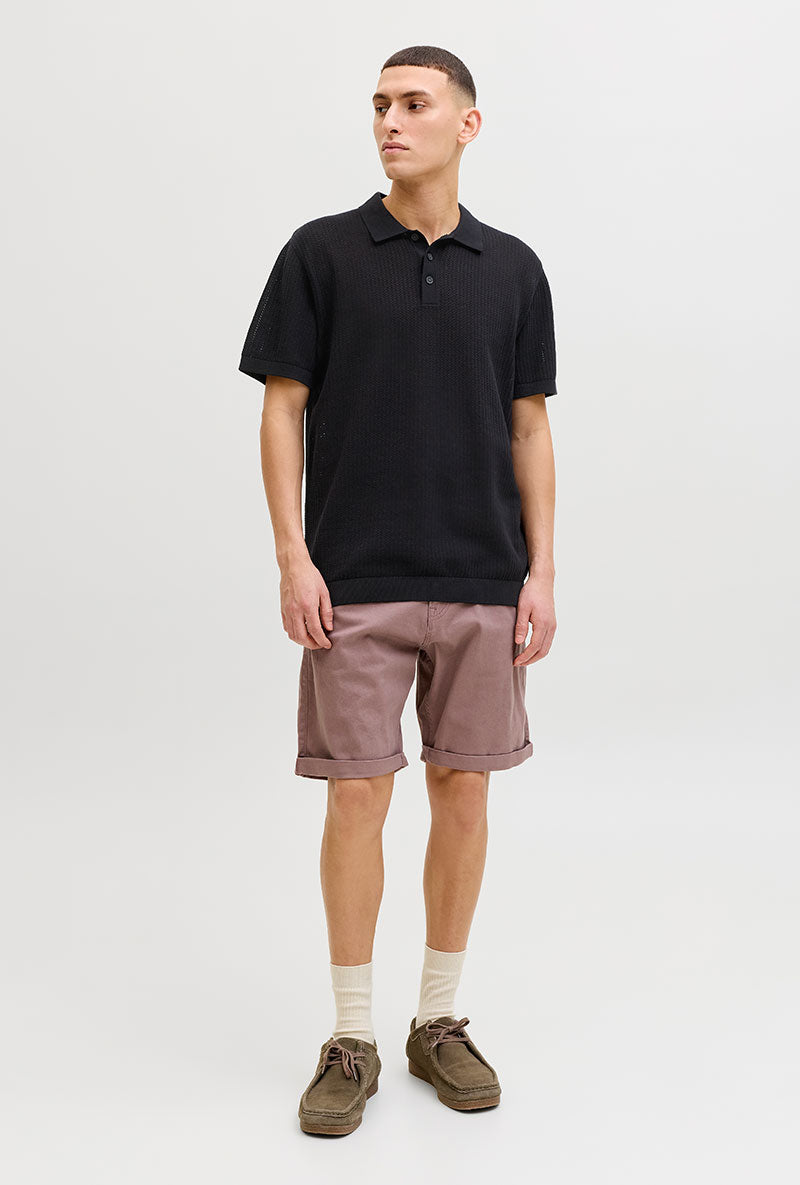 Front image of a model wearing Jess knit polo in black, by brand Jack&jones