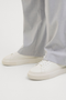 Front image of a model wearing the Jack and jones aspire cupsole sneaker in white, by brand Jack&jones