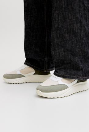 Front image of a model wearing Jack and jones aspire pu runner in white, by brand Jack&jones