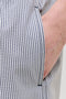 Front pocket detail image of a model wearing the Maui ocean seersucker swimshorts in navy, by brand Jack&jones