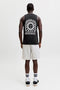 Back image of a model wearing the Sunset back print sleeveless tshirt in black, by brand Jack&jones