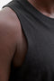 Front image of a model wearing the Sunset back print sleeveless tshirt in black, by brand Jack&jones