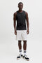 Front image of a model wearing the Sunset back print sleeveless tshirt in black, by brand Jack&jones
