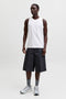 Front image of a model wearing the Sunset back print sleeveless tshirt in white, by brand Jack&jones
