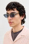 Front image of a model wearing the Avey sunglasses in green, by brand Jack&jones