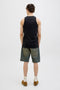 Back image of a model wearing the Jack and jones hawaii pocket tanktop in black, by brand Jack&jones
