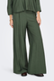 Close up image of a model wearing the Jdy pepper palazzo pants in olive, by brand Jacqueline de yong