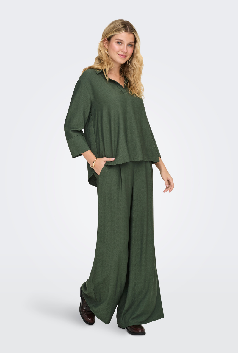 Front image of a model wearing Jdy pepper palazzo pants in olive, by brand Jacqueline de yong