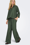 Front image of a model wearing the Jdy pepper palazzo pants in olive, by brand Jacqueline de yong