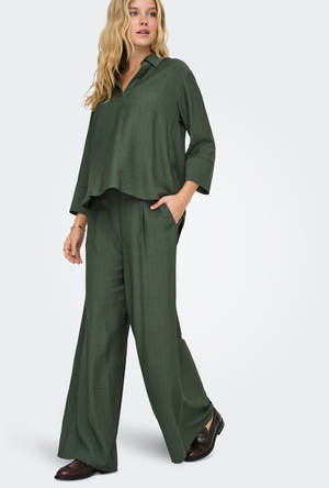 Front image of a model wearing the Jdy pepper palazzo pants in olive, by brand Jacqueline de yong
