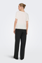 Back image of a model wearing the Jdy sissy s/s vneck top in off white, by brand Jacqueline de yong