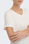 Detail image of a model wearing the Jdy sissy s/s vneck top in off white, by brand Jacqueline de yong