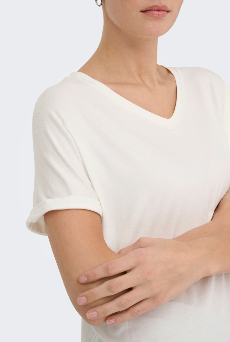 Detail image of a model wearing Jdy sissy s/s vneck top in off white, by brand Jacqueline de yong