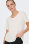 Front image of a model wearing the Jdy sissy s/s vneck top in off white, by brand Jacqueline de yong