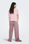 Back image of a model wearing the Jdy sissy s/s vneck top in pink, by brand Jacqueline de yong