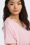 Detail image of a model wearing the Jdy sissy s/s vneck top in pink, by brand Jacqueline de yong