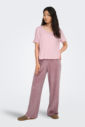Front image of a model wearing the Jdy sissy s/s vneck top in pink, by brand Jacqueline de yong