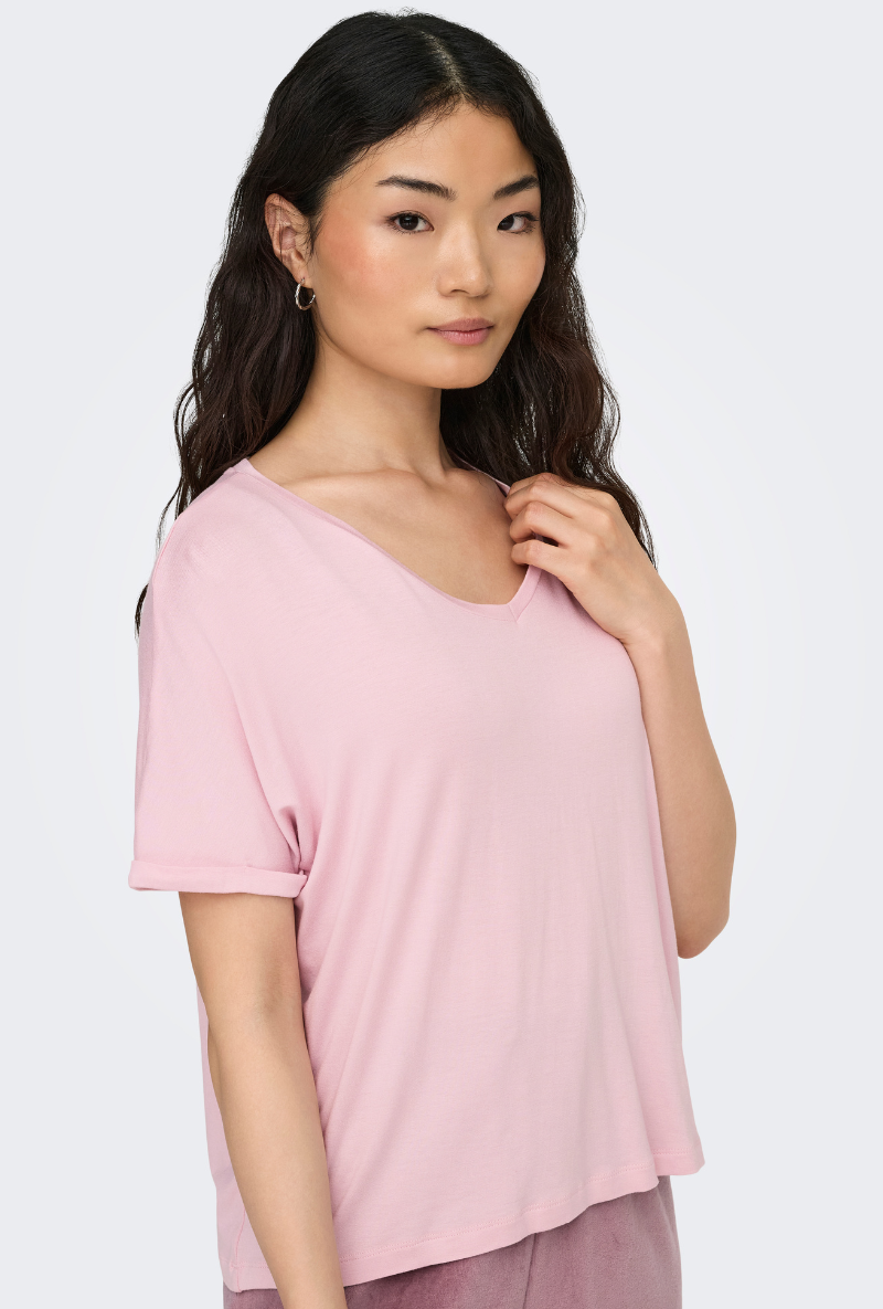 Front image of a model wearing Jdy sissy s/s vneck top in pink, by brand Jacqueline de yong