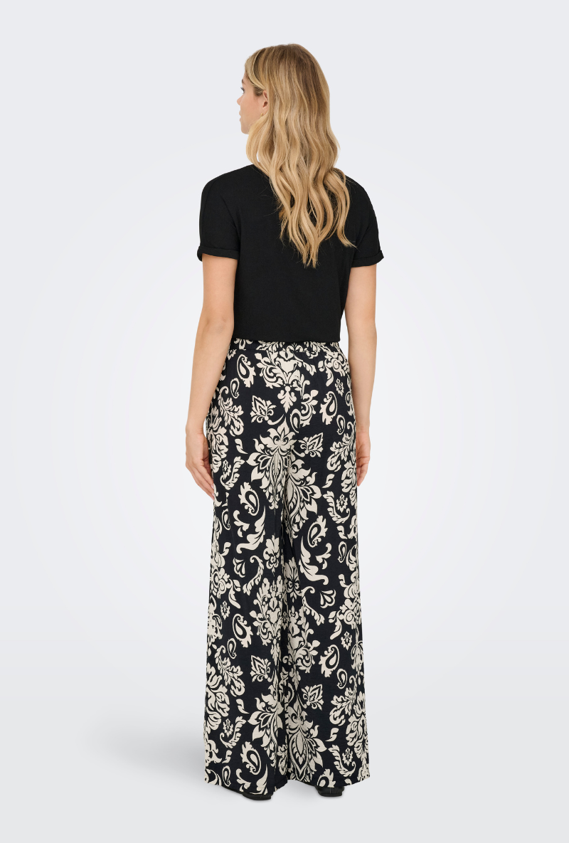Back image of a model wearing Jdy tami hw wide pants in black, by brand Jacqueline de yong