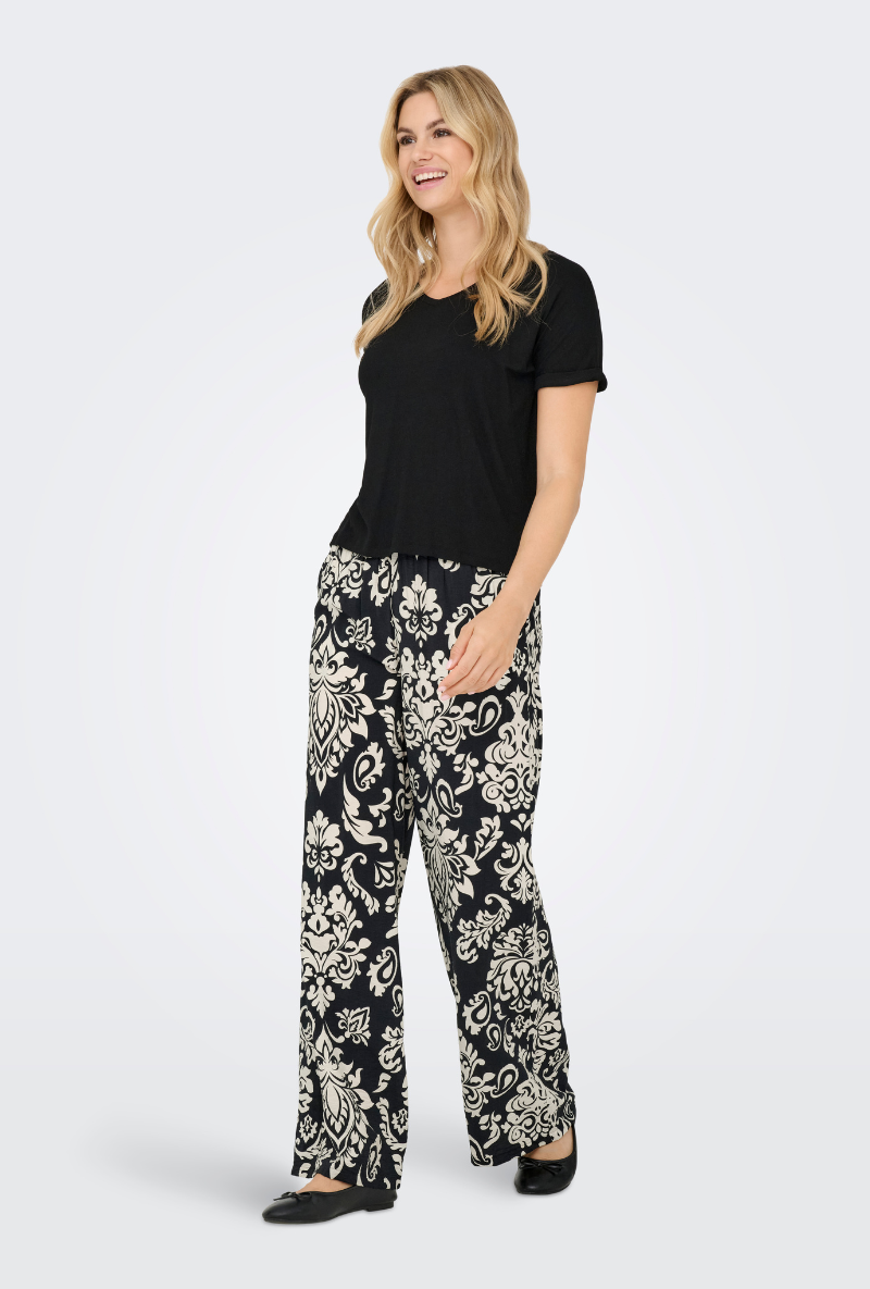 Front image of a model wearing Jdy tami hw wide pants in black, by brand Jacqueline de yong