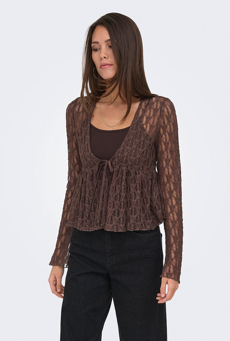 Front image of a model wearing Laya lace cardigan in brown, by brand Only