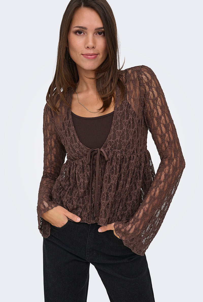 Front image of a model wearing Laya lace cardigan in brown, by brand Only