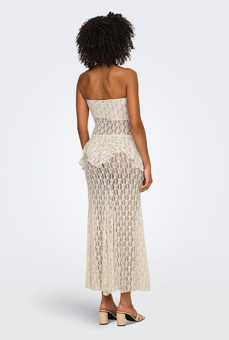 Back image of a model wearing Laya lace long skirt in cream, by brand Only