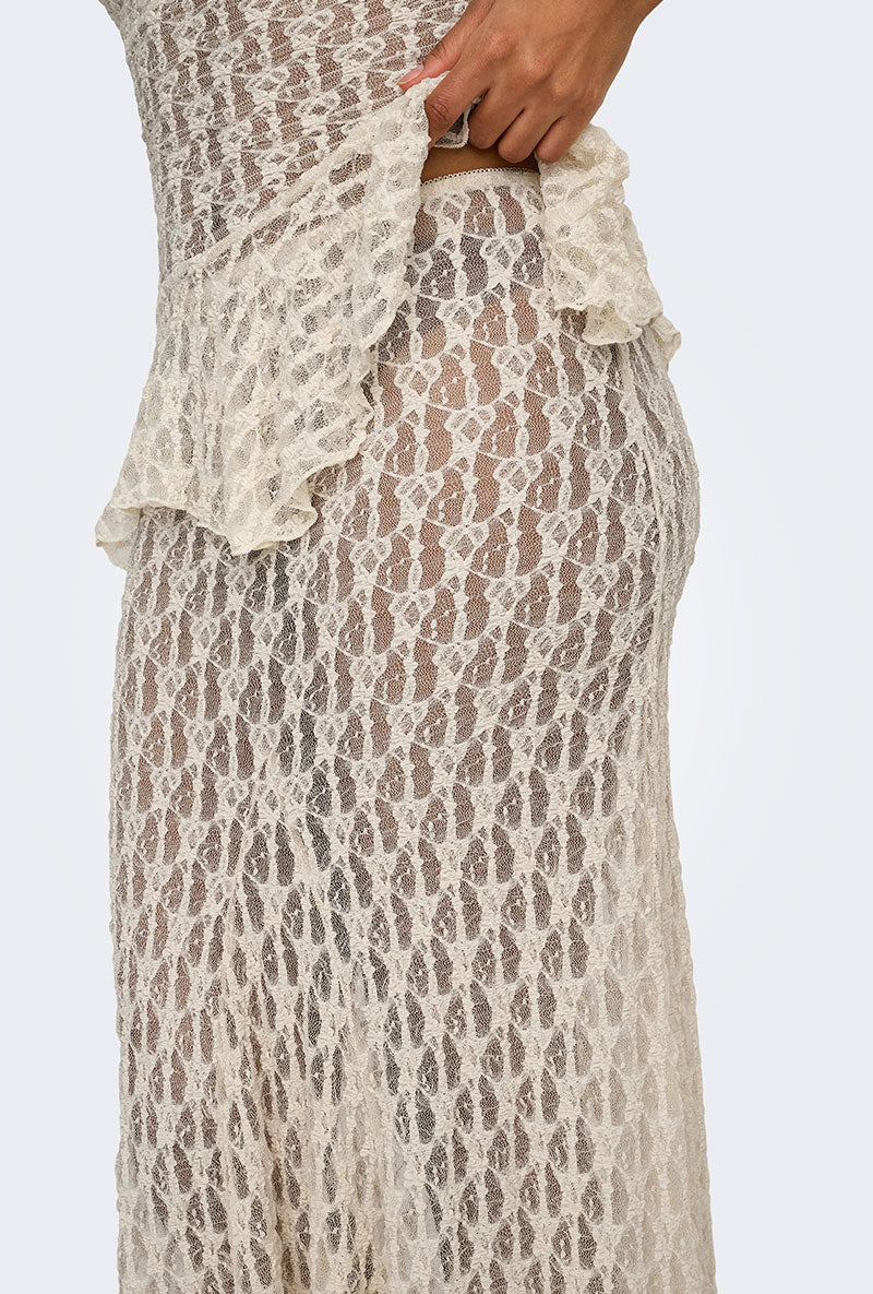 Side detail image of a model wearing Laya lace long skirt in cream, by brand Only