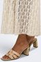 Bottom detail image of a model wearing the Laya lace long skirt in cream, by brand Only