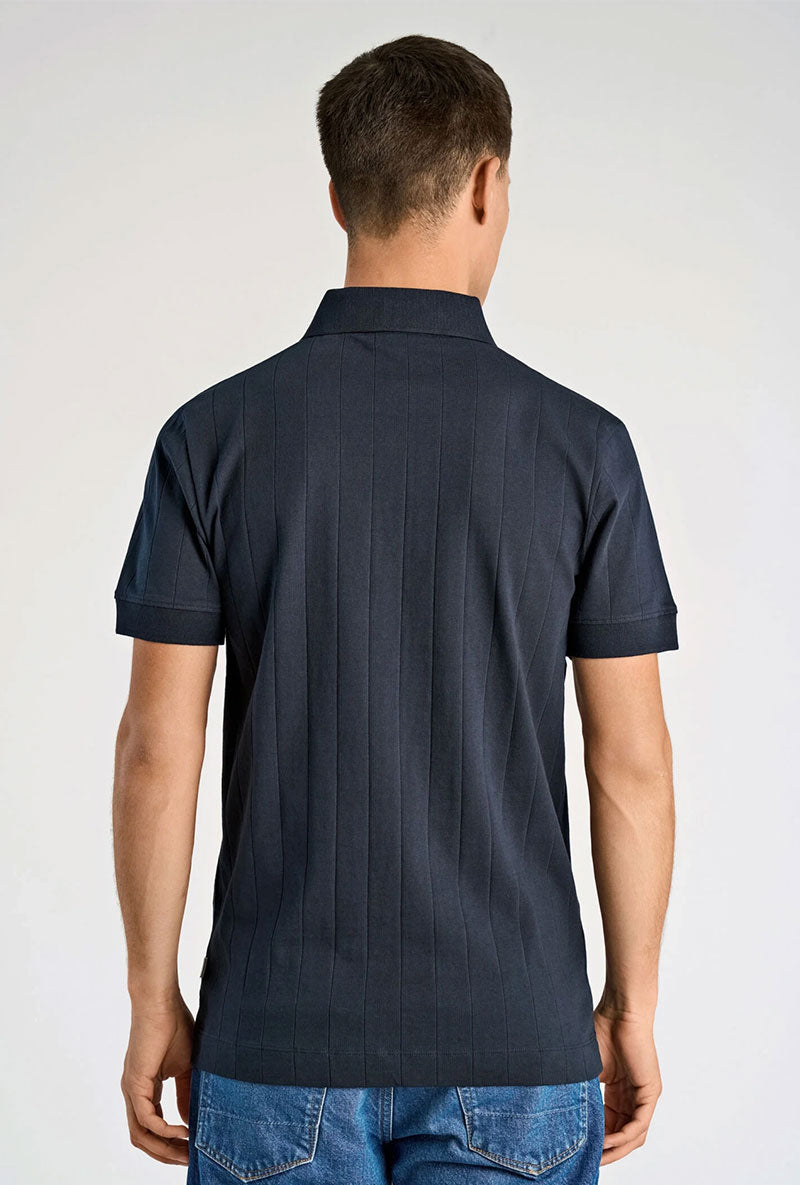Back image of a model wearing Needle drop s/s polo in navy, by brand Lindbergh