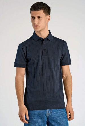 Front image of a model wearing the Needle drop s/s polo in navy, by brand Lindbergh