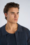 Front close up image of a model wearing the Crochet s/s shirt in navy, by brand Lindbergh