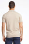 Back image of a model wearing the Ecovero s/s knit polo in sand, by brand Lindbergh