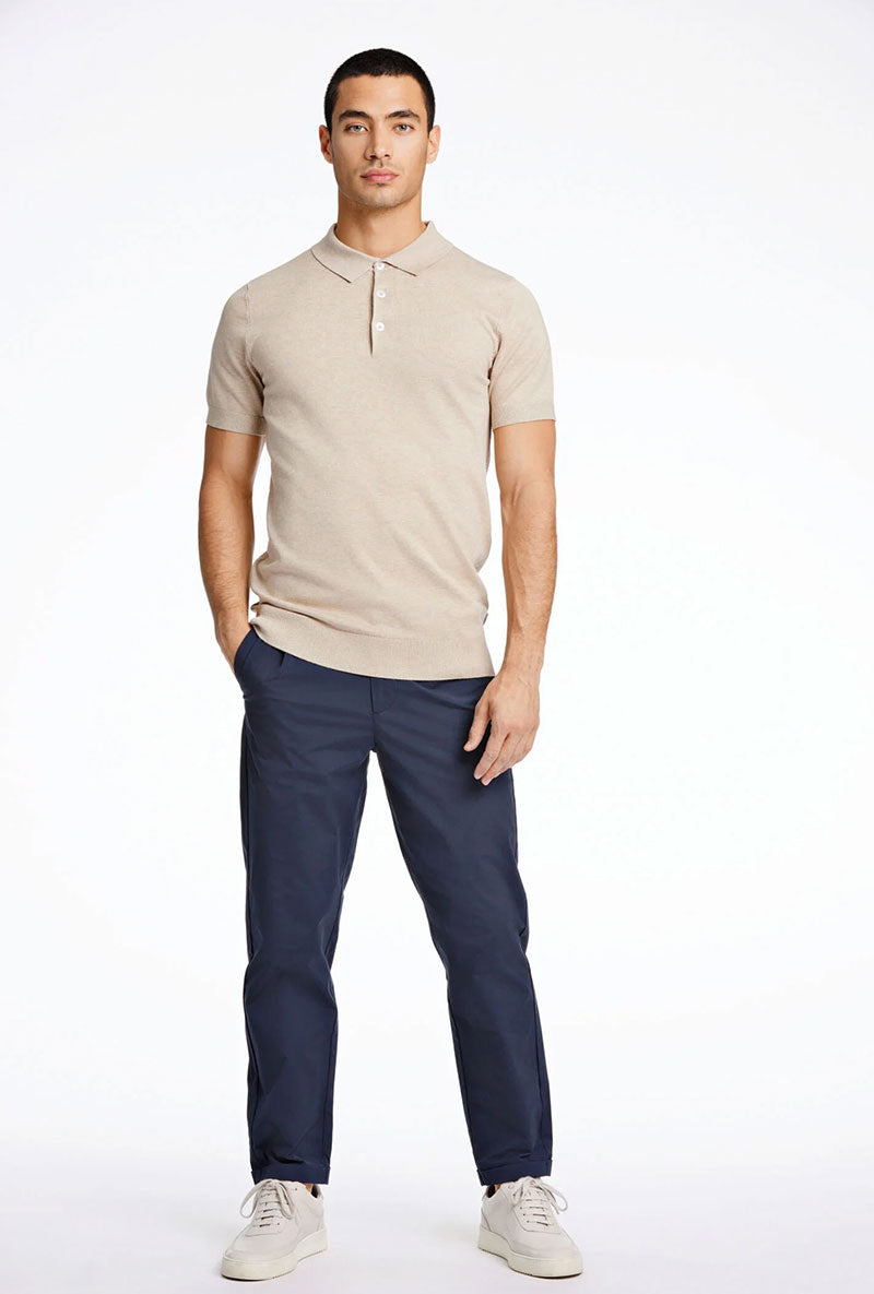 Front image of a model wearing Ecovero s/s knit polo in sand, by brand Lindbergh