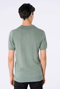 Back image of a model wearing the Ecovero s/s knit polo in light green, by brand Lindbergh