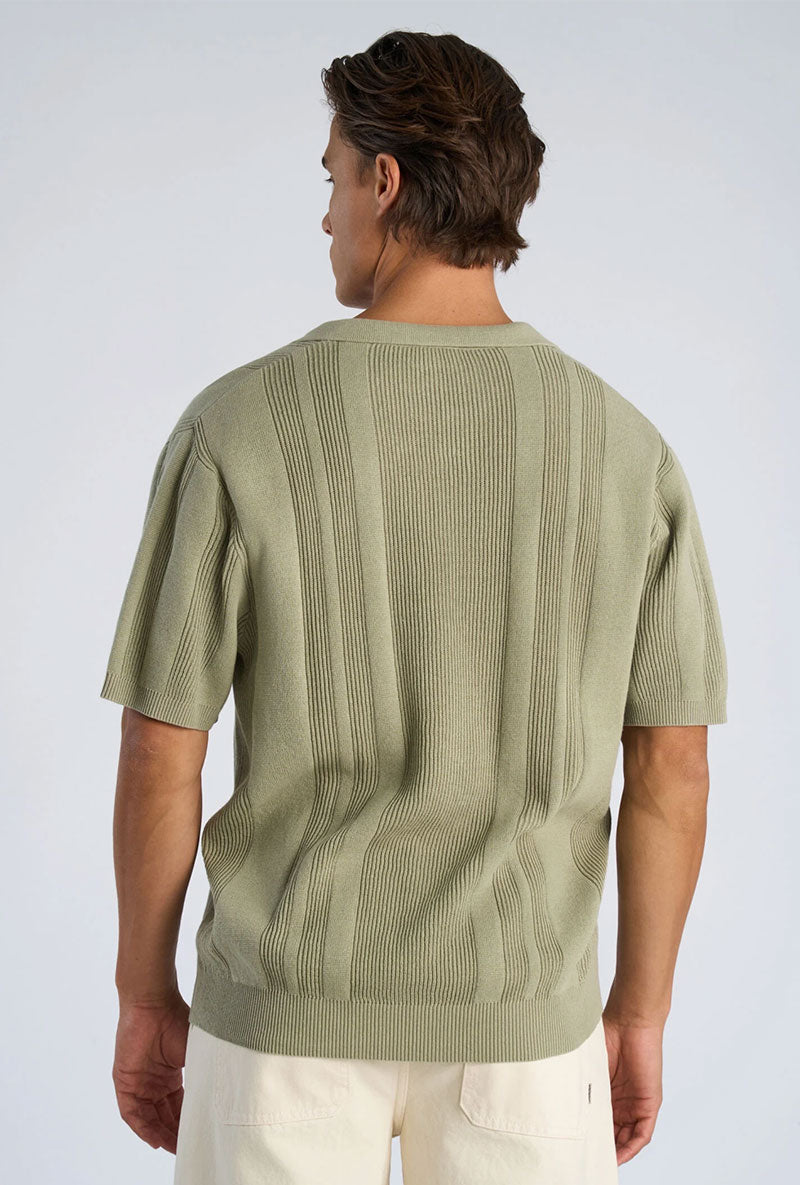 Back image of a model wearing Knitted s/s polo in light green, by brand Lindbergh